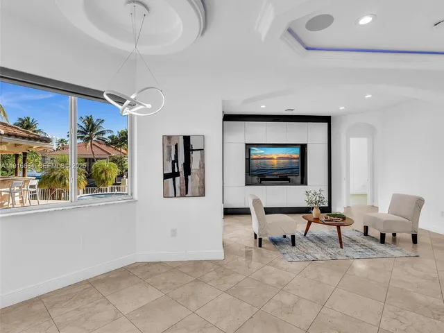 a bath tub sitting in a bathroom next to a sink
