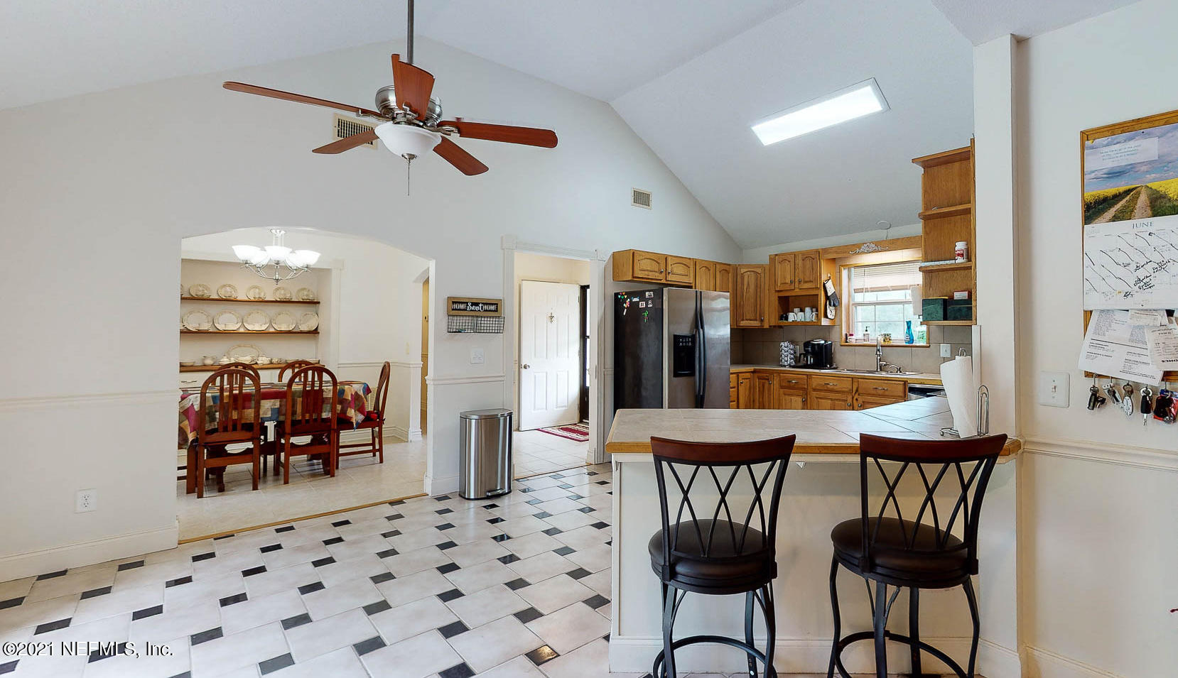 2053 Cornell Road Middleburg, FL 32068 - Photo 11 of 38 a dining room with furniture and chandelier