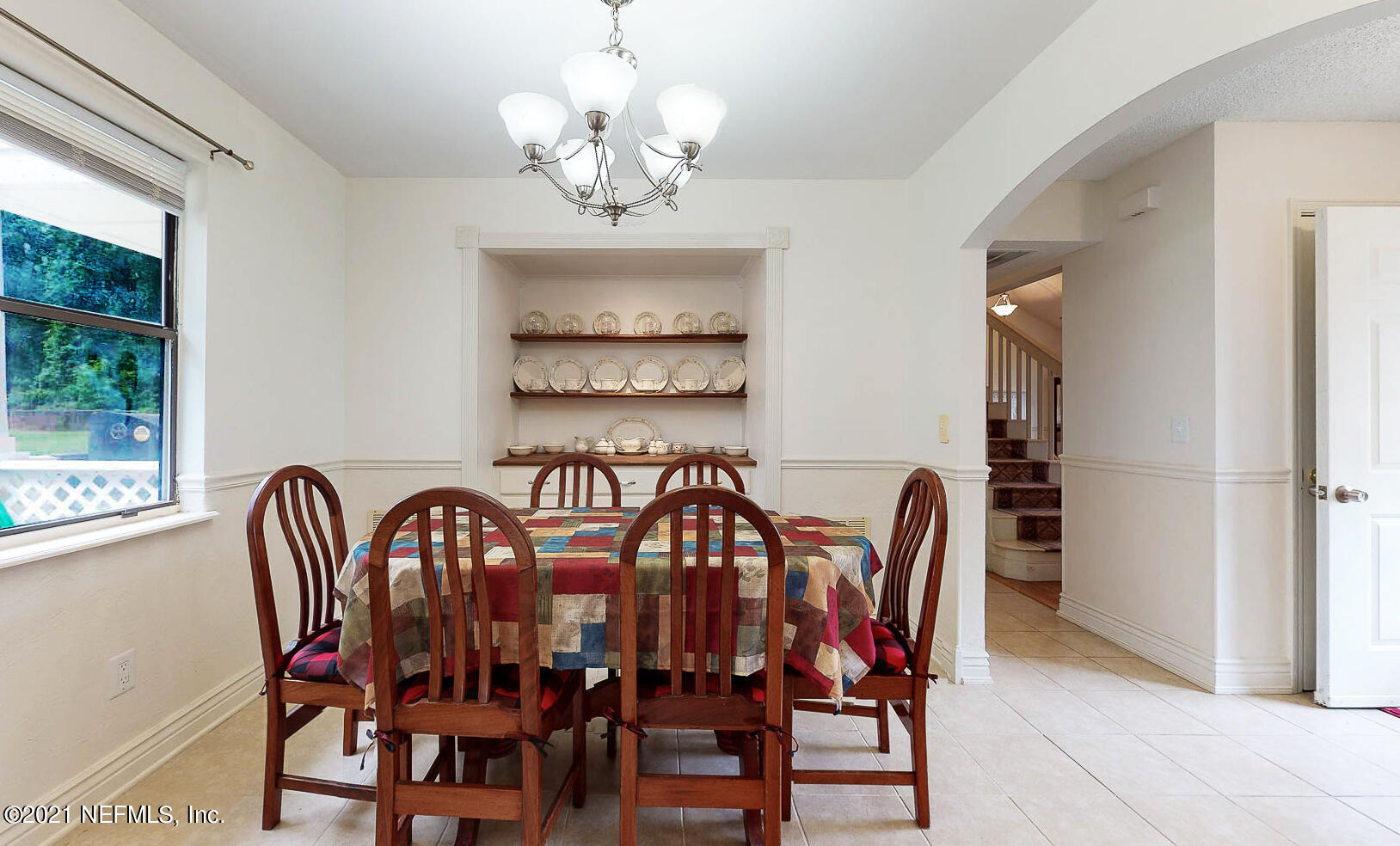 2053 Cornell Road Middleburg, FL 32068 - Photo 12 of 38 a view of a dining room with furniture a chandelier and window