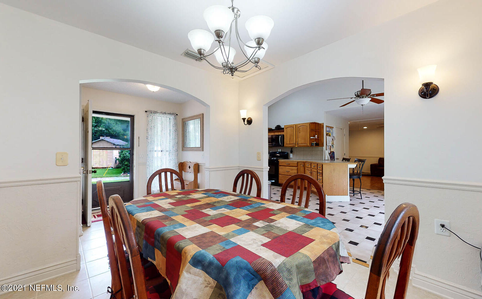 2053 Cornell Road Middleburg, FL 32068 - Photo 13 of 38 a view of a dining room with furniture and chandelier