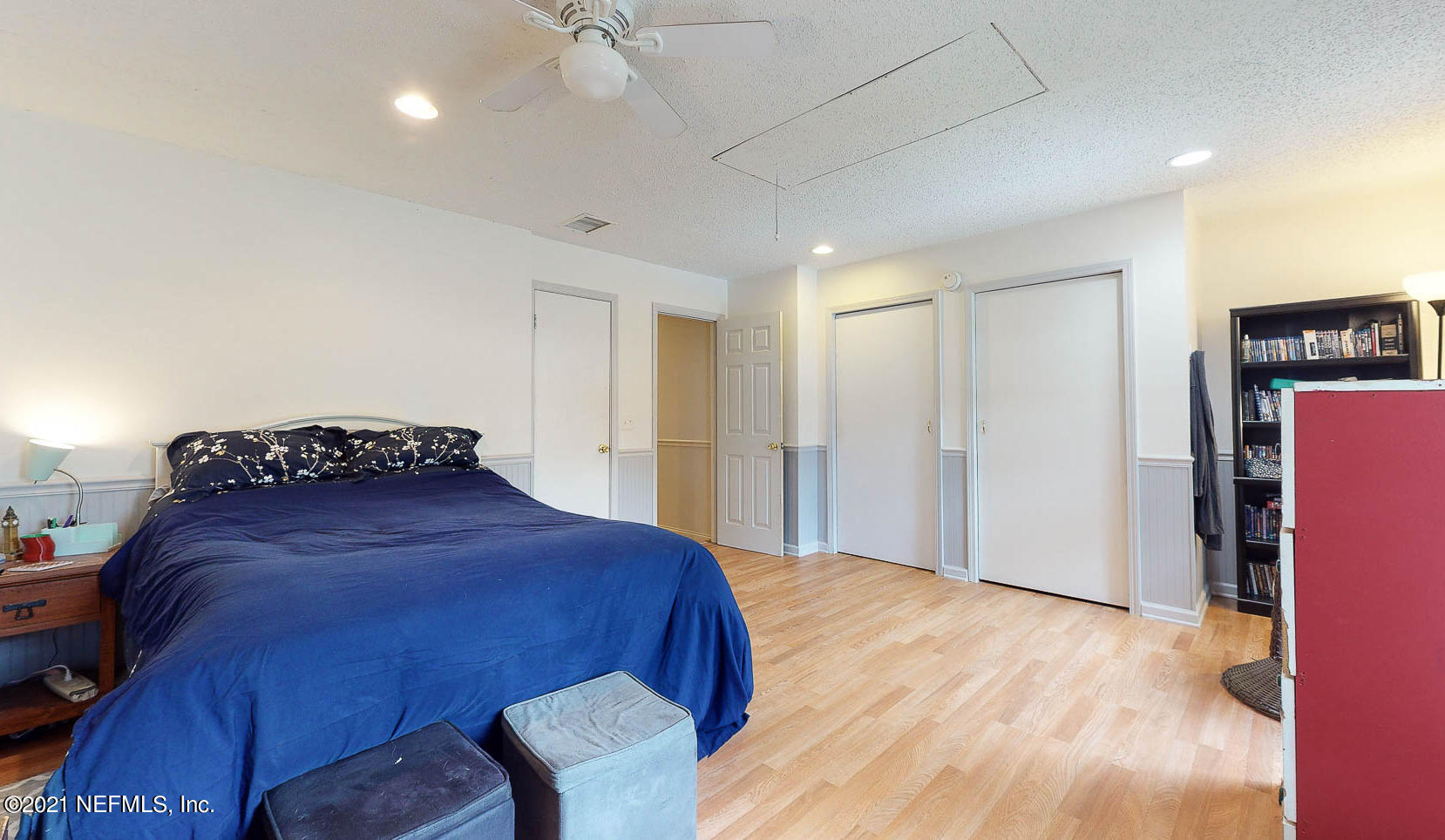 2053 Cornell Road Middleburg, FL 32068 - Photo 23 of 38 a spacious bedroom with a bed and wooden floor