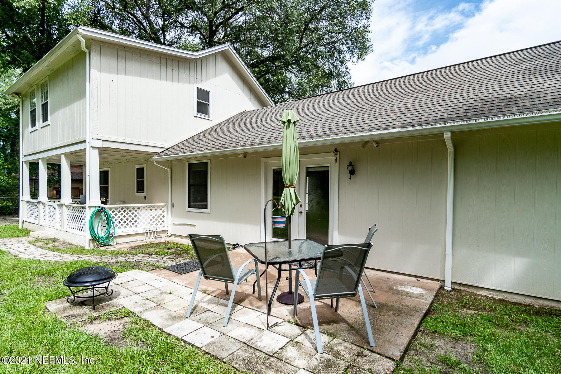 2053 Cornell Road Middleburg, FL 32068 - Photo 27 of 38 a view of house with backyard sitting area and swimming pool