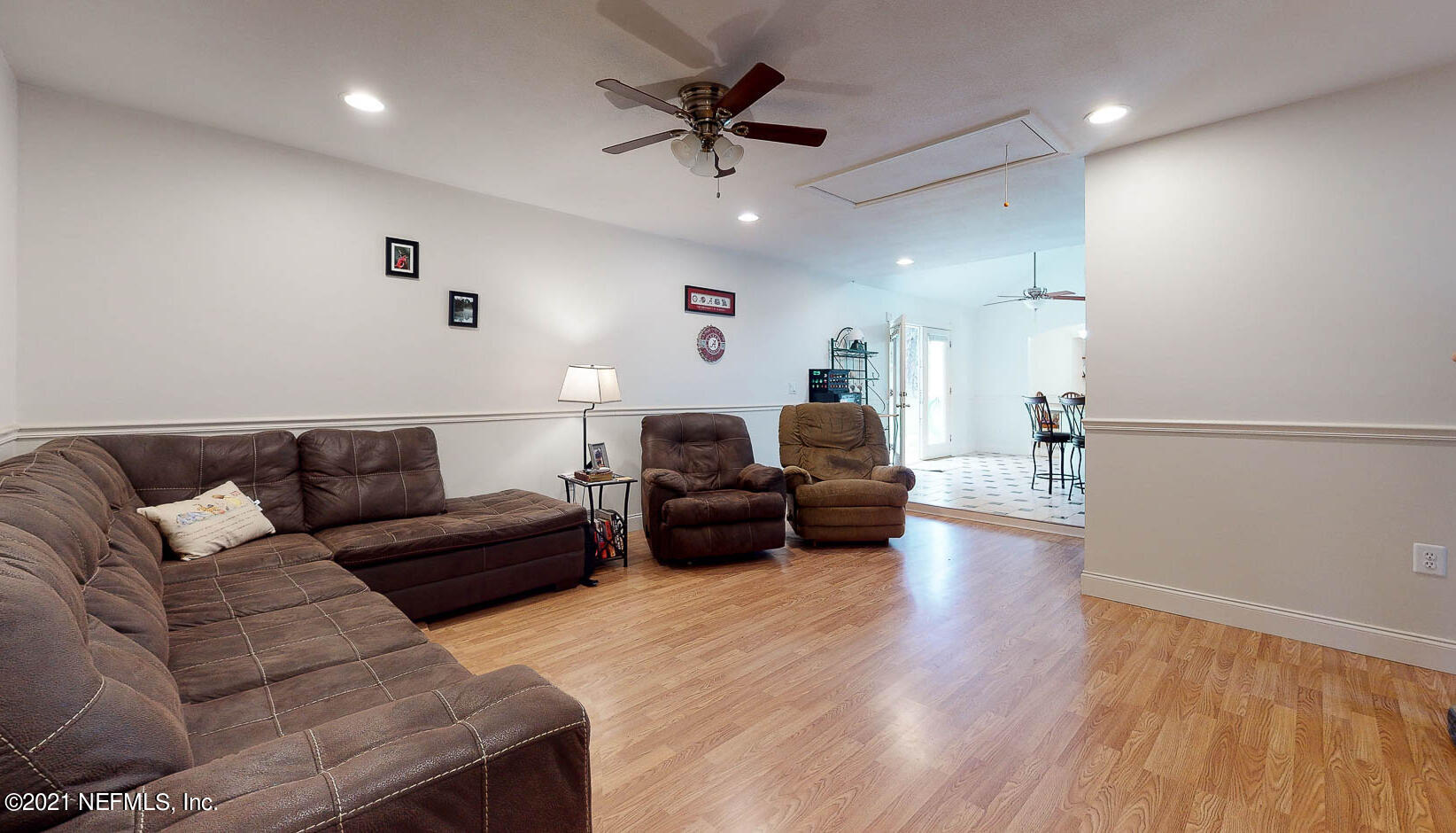 2053 Cornell Road Middleburg, FL 32068 - Photo 7 of 38 a living room with furniture and a wooden floor