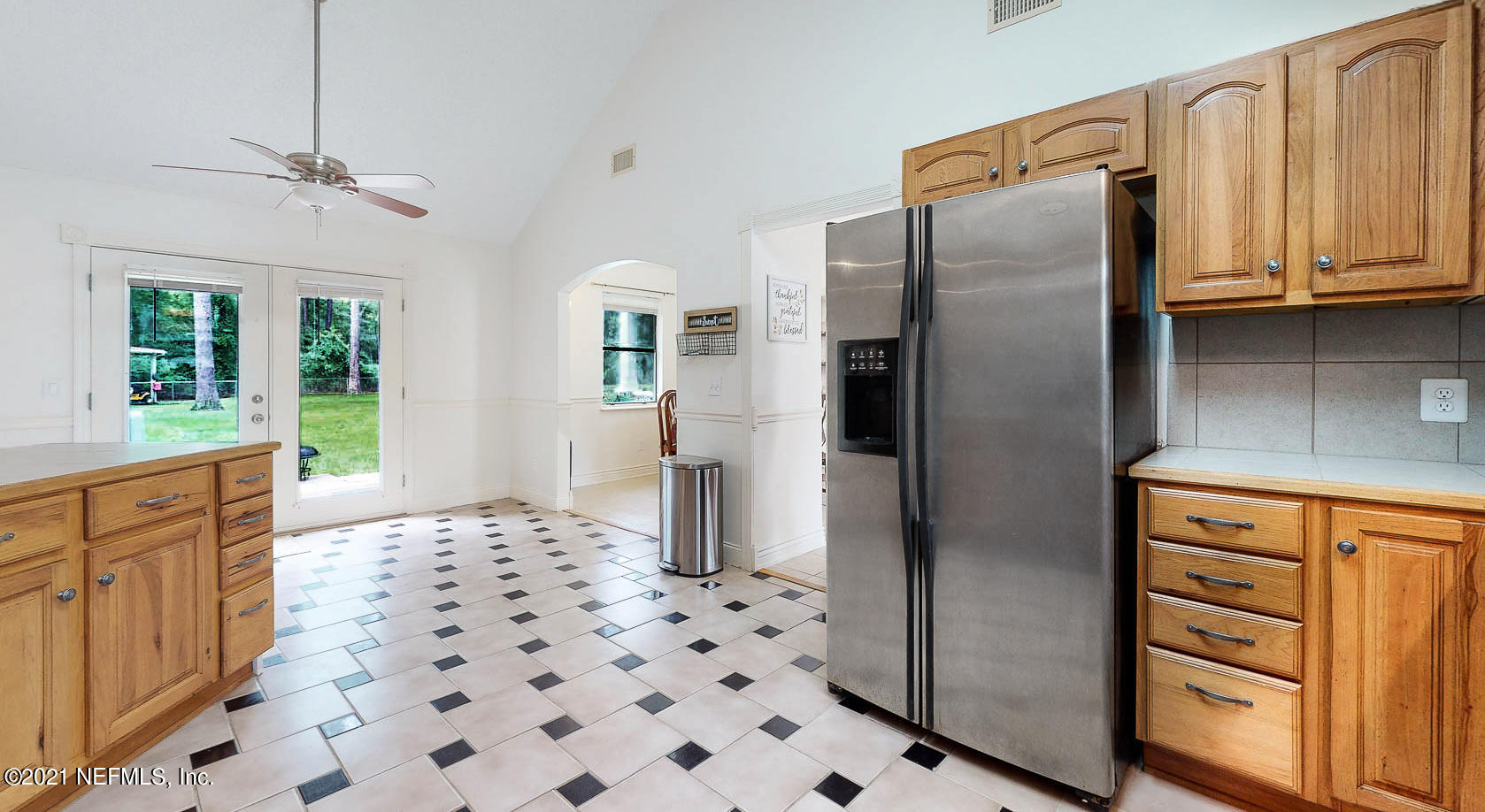 2053 Cornell Road Middleburg, FL 32068 - Photo 9 of 38 a kitchen with granite countertop a refrigerator and a sink