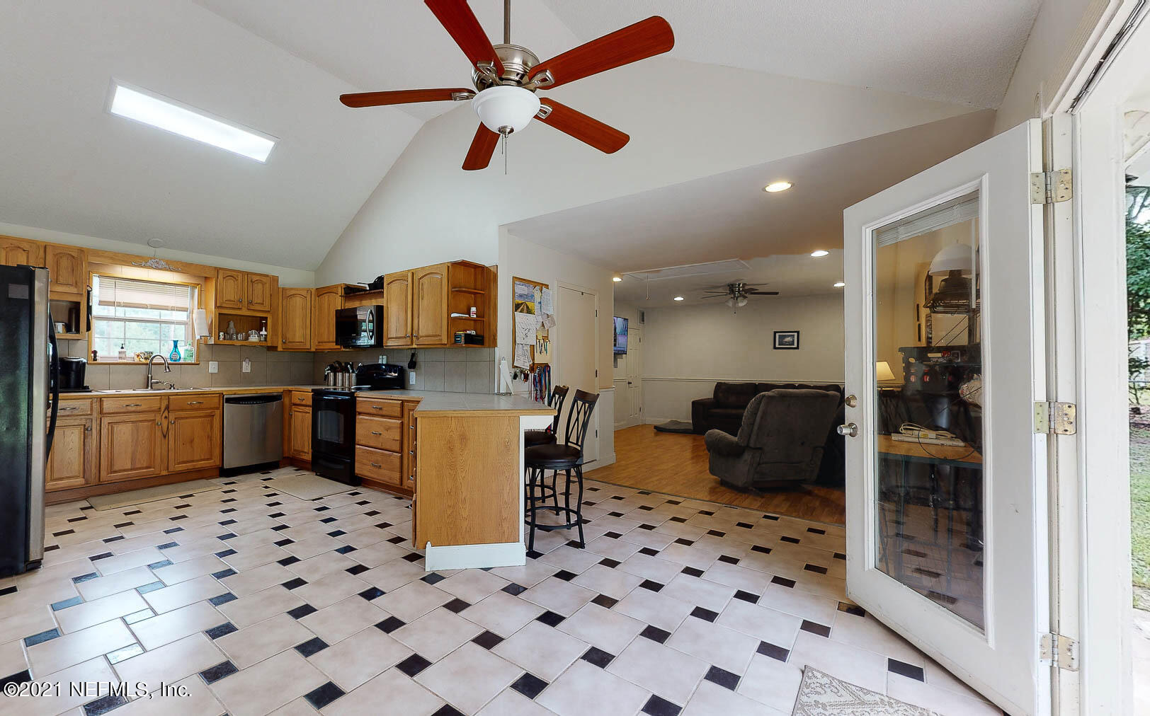 2053 Cornell Road Middleburg, FL 32068 - Photo 10 of 38 a kitchen with a sink a counter top space cabinets and stainless steel appliances
