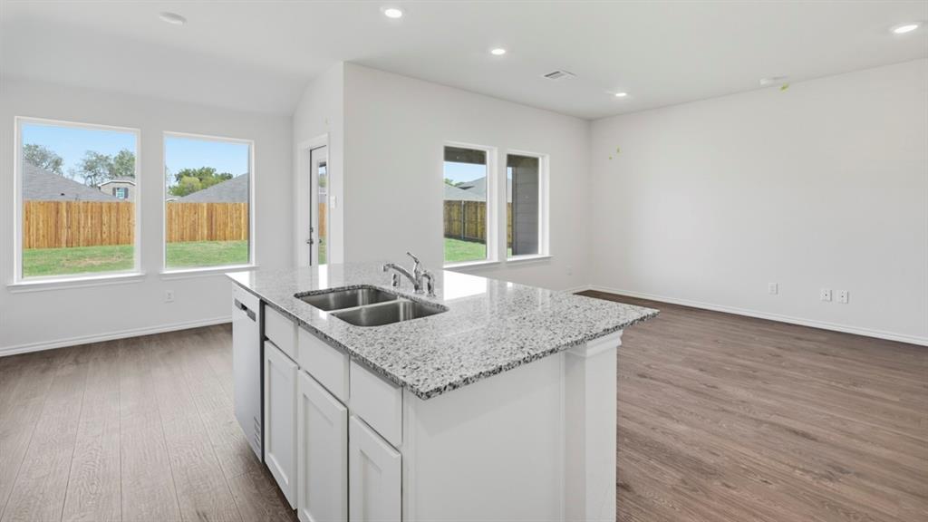 508 Wild Rose Way Princeton, TX 75407 - Photo 17 of 33 a kitchen with a sink and a window