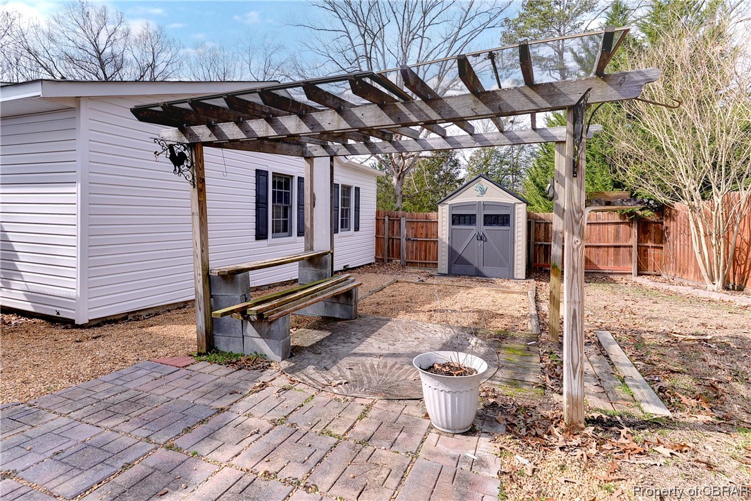 3159 Old Stage Road Toano, VA 23168 - Photo 37 of 44 A second storage shed and gazebo on side of home.