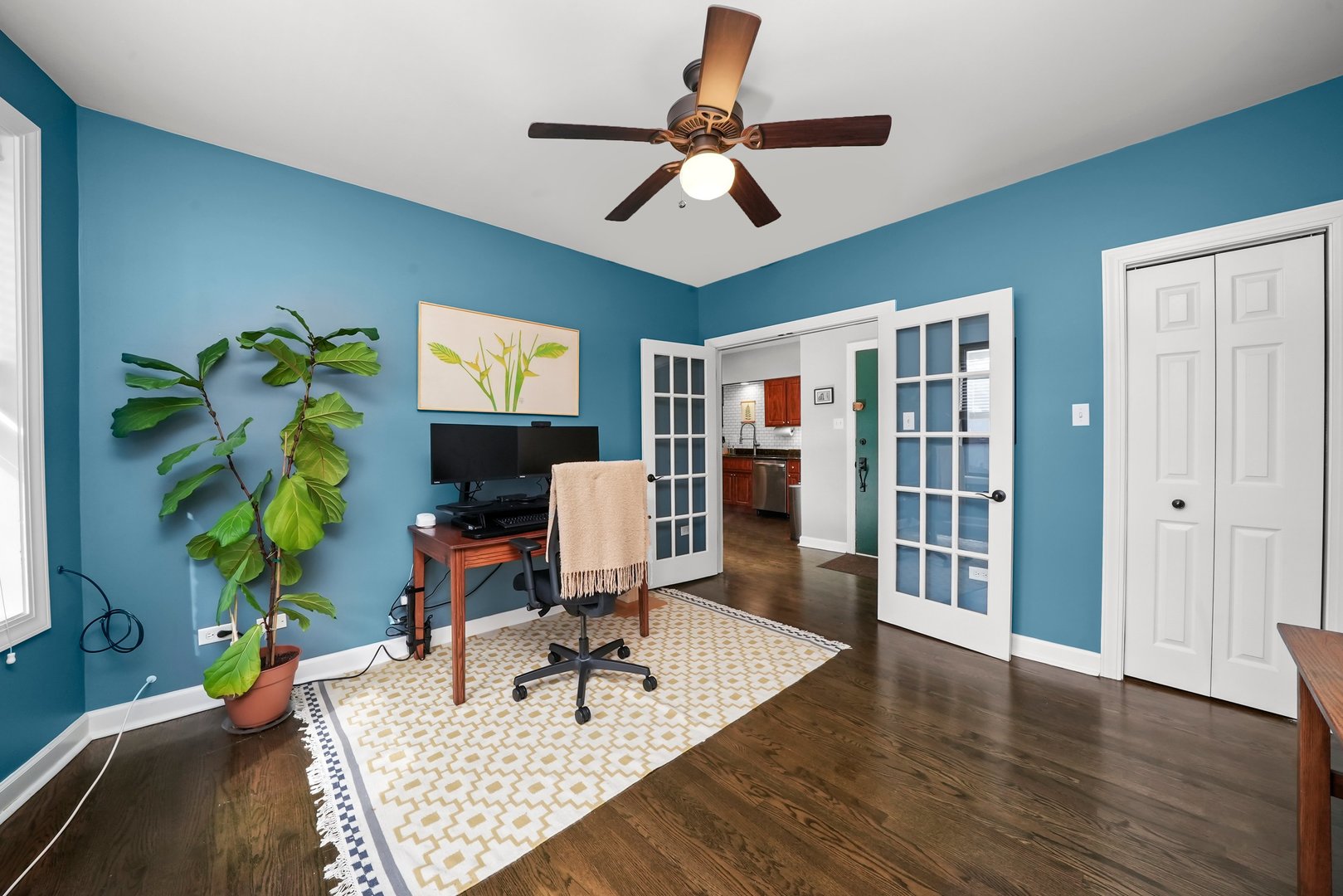 923 West Addison Street, Unit 2A Chicago, IL 60613 - Photo 8 of 9 a work room with furniture and wooden floor