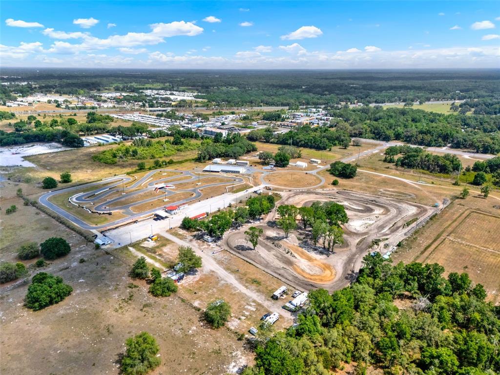 5765 Pit Road Bushnell, FL 33513 - Photo 24 of 35 an aerial view of a city