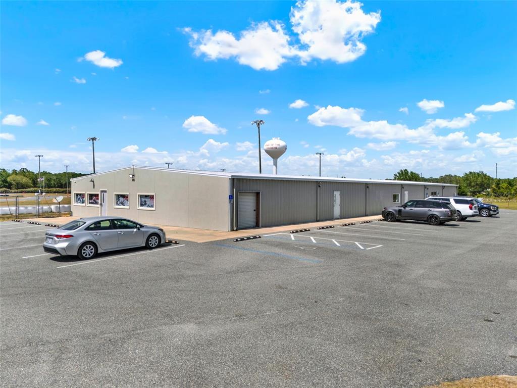 5765 Pit Road Bushnell, FL 33513 - Photo 26 of 35 a view of street with parked cars