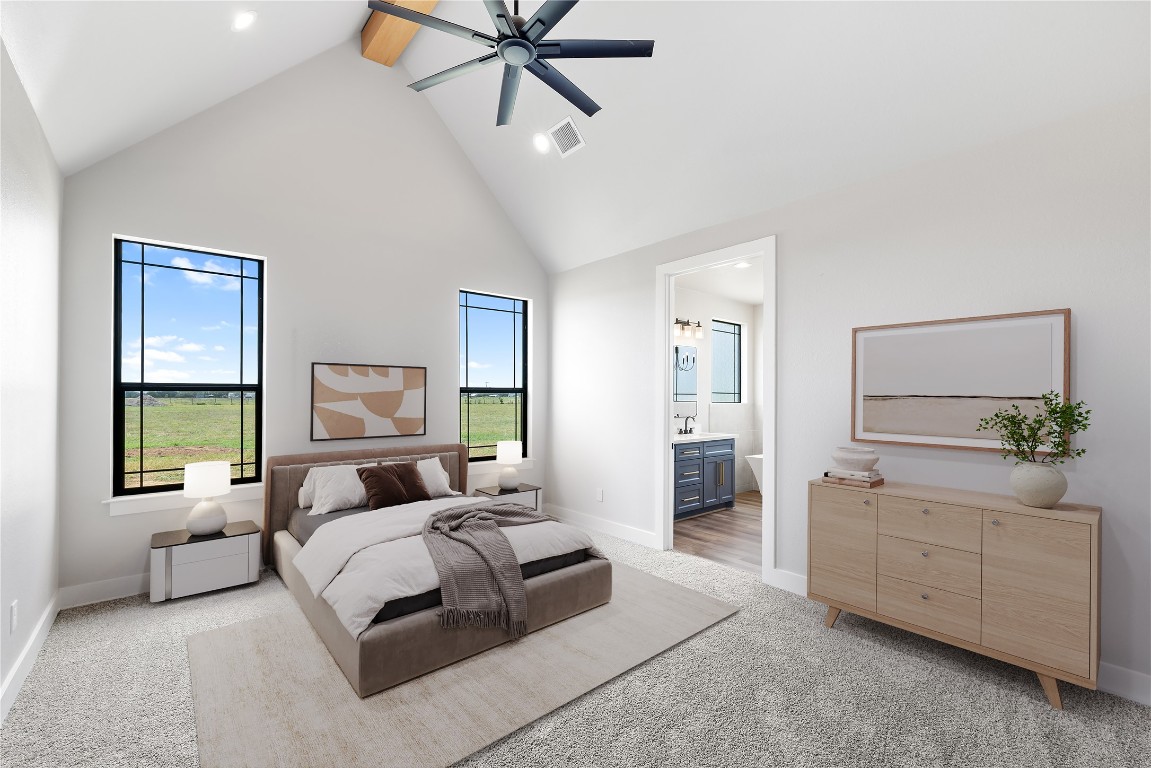 114 Country View Lane Road Schulenburg, TX 78956 - Photo 13 of 27 a bedroom with a large bed and a chandelier