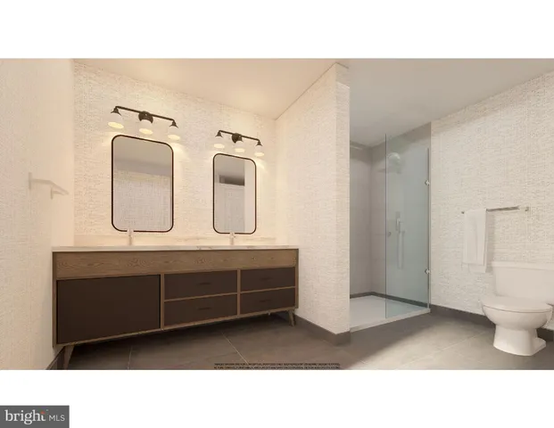 a bathroom with a double vanity sink and mirror