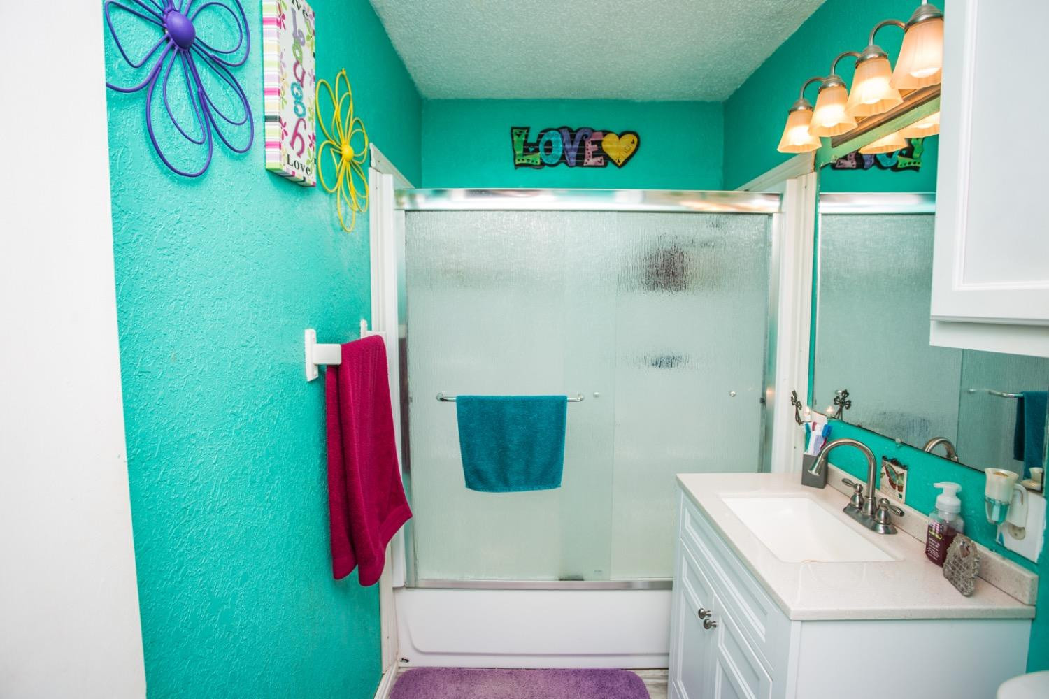 306 Terry Avenue Wellman, TX 79316 - Photo 17 of 32 a bathroom with a sink and a mirror