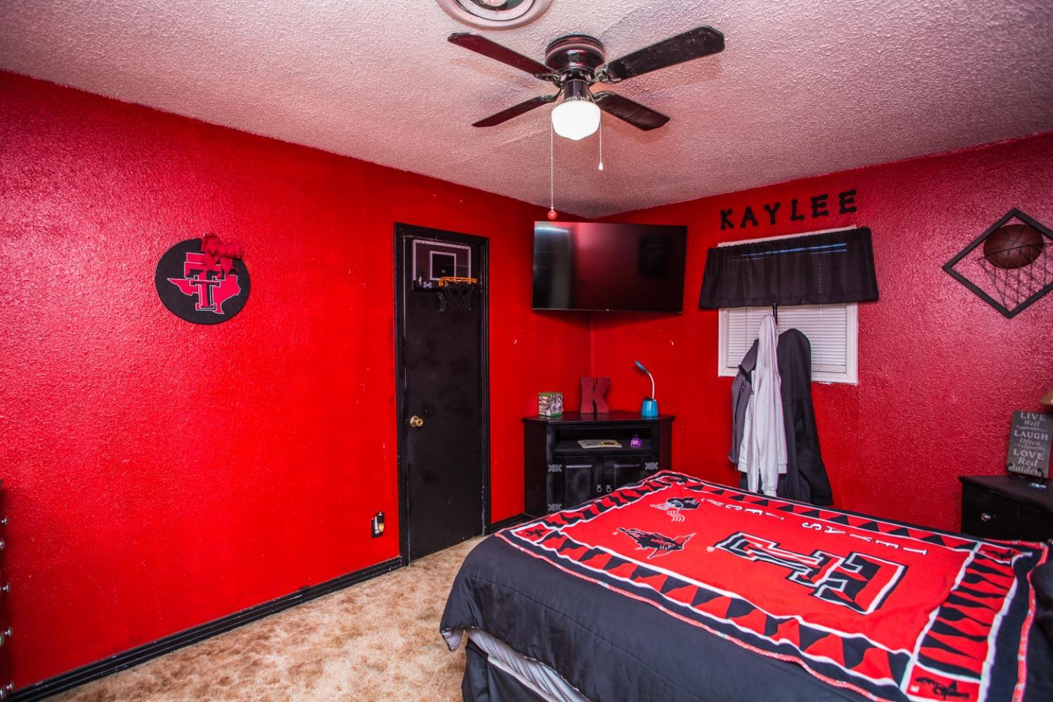 306 Terry Avenue Wellman, TX 79316 - Photo 18 of 32 a bedroom with bed and a bookshelf