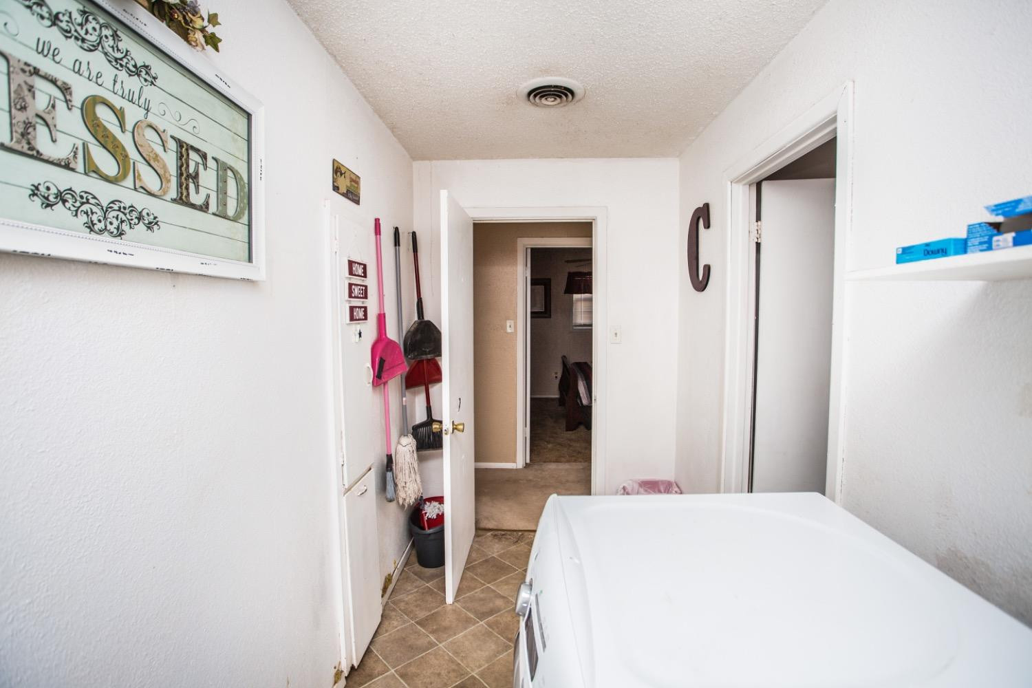 306 Terry Avenue Wellman, TX 79316 - Photo 25 of 32 a bed room with a bed and a closet
