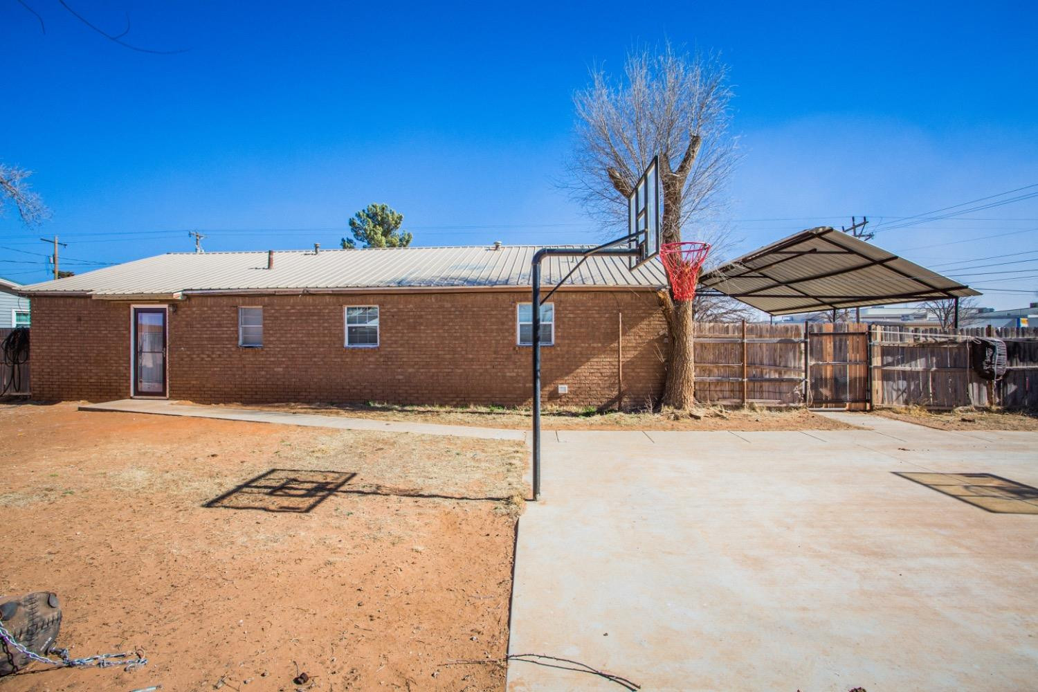 306 Terry Avenue Wellman, TX 79316 - Photo 26 of 32 a front view of a house with a yard