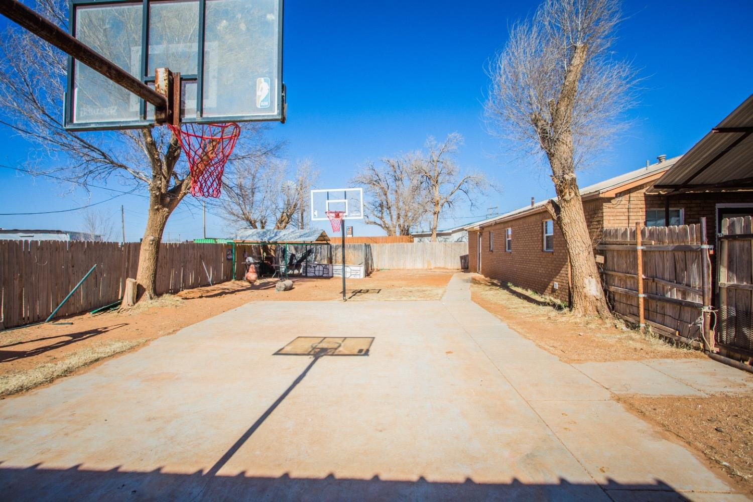 306 Terry Avenue Wellman, TX 79316 - Photo 28 of 32 a view of a swimming pool with a patio
