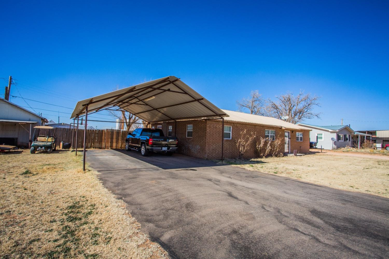 306 Terry Avenue Wellman, TX 79316 - Photo 32 of 32 a car parked in front of house