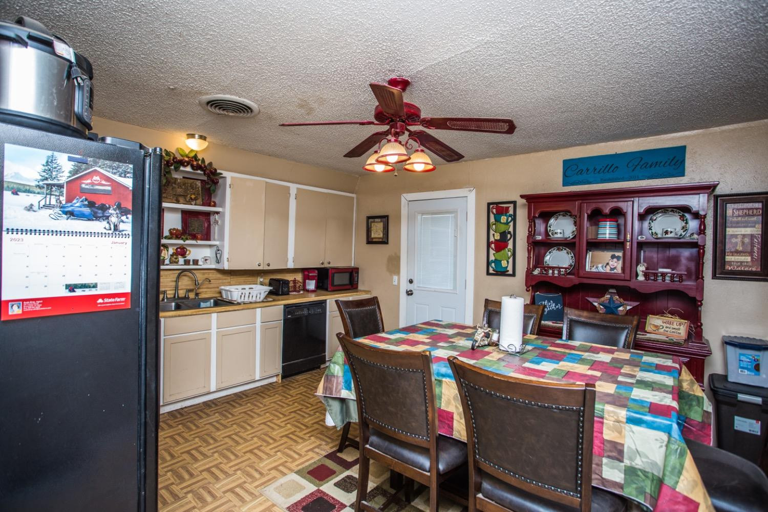 306 Terry Avenue Wellman, TX 79316 - Photo 8 of 32 a kitchen that has a lot of cabinets a stove and a bookshelf