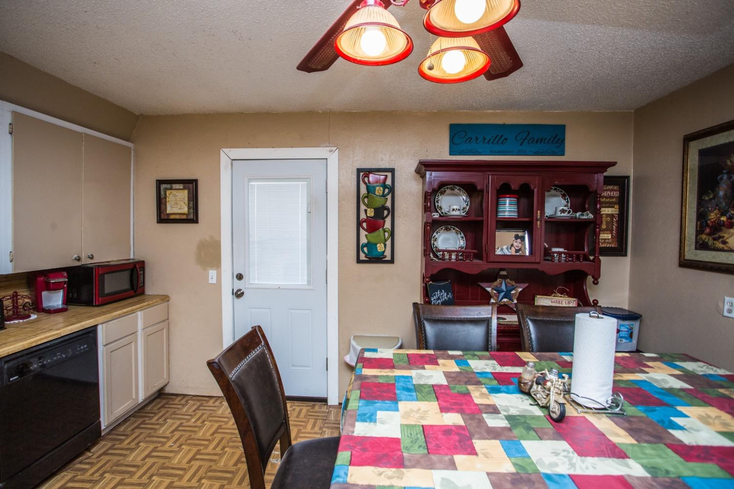 306 Terry Avenue Wellman, TX 79316 - Photo 9 of 32 a bedroom with a bed and a bookshelf in it