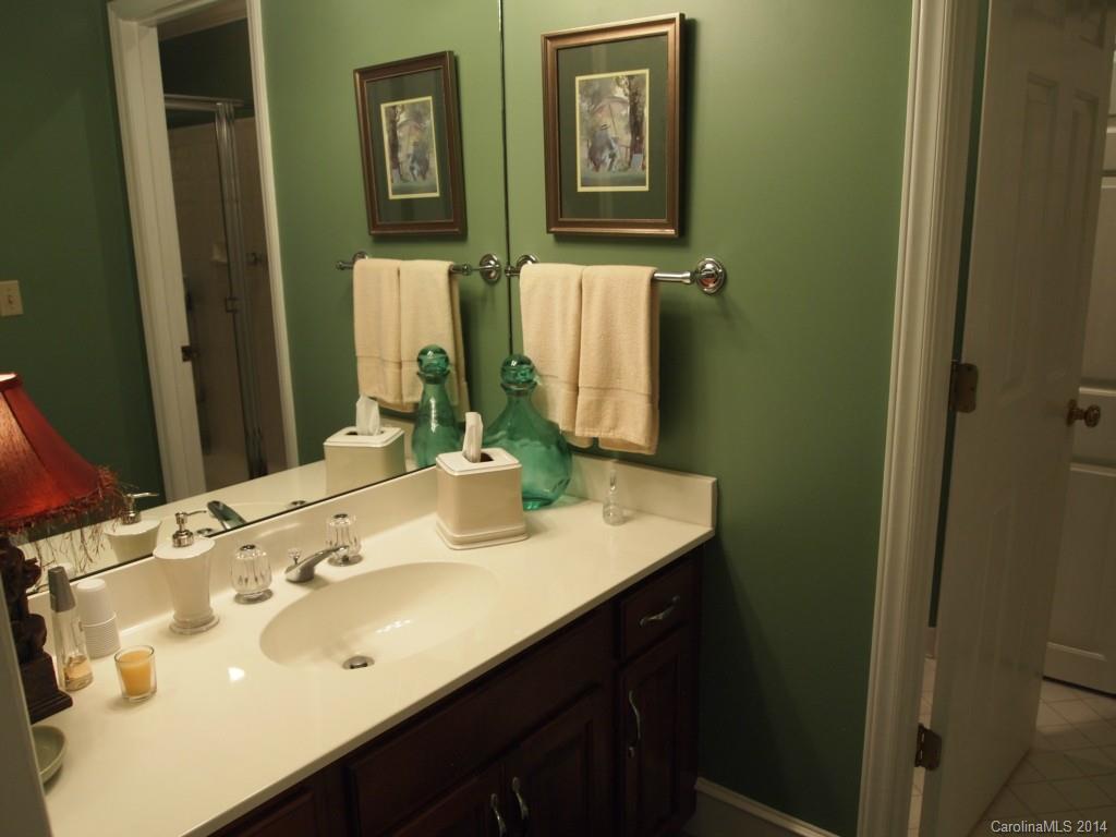 557 Cranborne Chase, Unit 16 Fort Mill, SC 29708 - Photo 14 of 23 a bathroom with a sink and a mirror