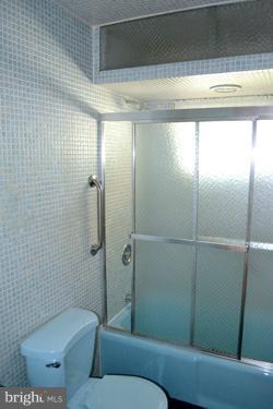 8106 Ridgely Oak Road Baltimore, MD 21234 - Photo 1 of 21 a bathroom with a toilet and a shower