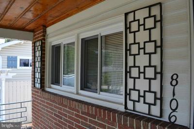 8106 Ridgely Oak Road Baltimore, MD 21234 - Photo 11 of 21 a view of a porch with a table and chairs