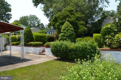 8106 Ridgely Oak Road Baltimore, MD 21234 - Photo 12 of 21 a view of a garden with a patio