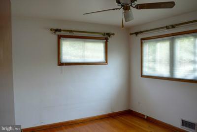 8106 Ridgely Oak Road Baltimore, MD 21234 - Photo 15 of 21 a view of empty room with window and fan