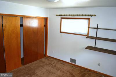 8106 Ridgely Oak Road Baltimore, MD 21234 - Photo 5 of 21 a view of an empty room with a window