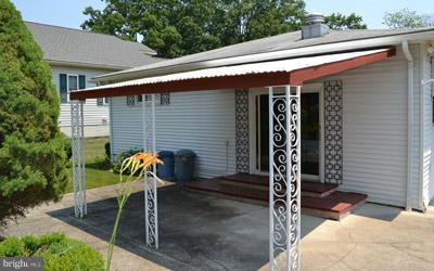 8106 Ridgely Oak Road Baltimore, MD 21234 - Photo 7 of 21 a front view of a house with garden