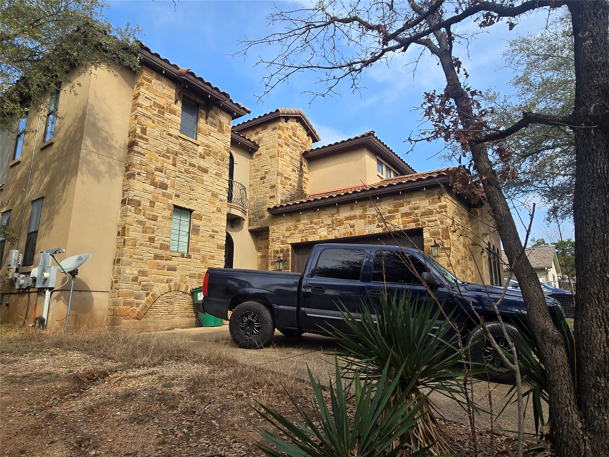 1310 Minnie Drive Austin, TX 78732 - Photo 2 of 4 a view of a car parked in front of a house