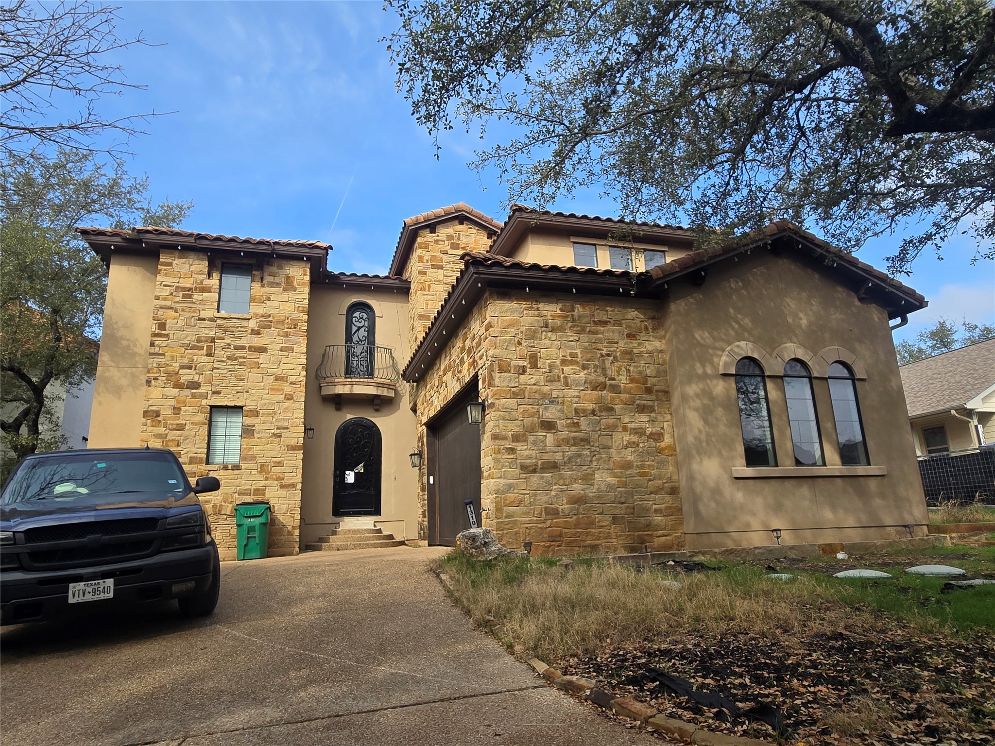 1310 Minnie Drive Austin, TX 78732 - Photo 4 of 4 a car parked in front of a house