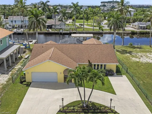 a aerial view of a house with a yard