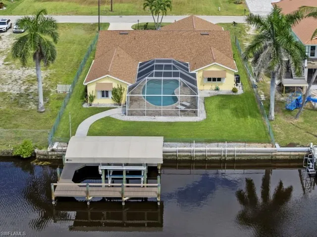 an aerial view of a house with swimming pool