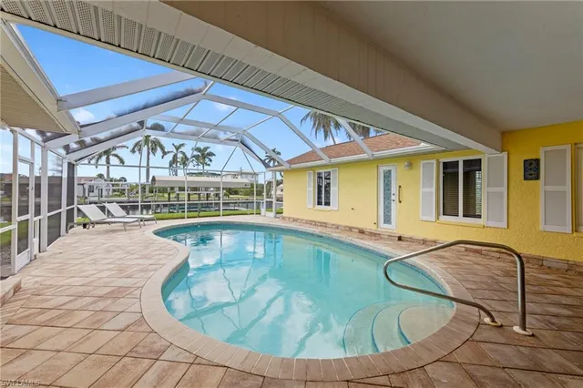 a view of a house with swimming pool