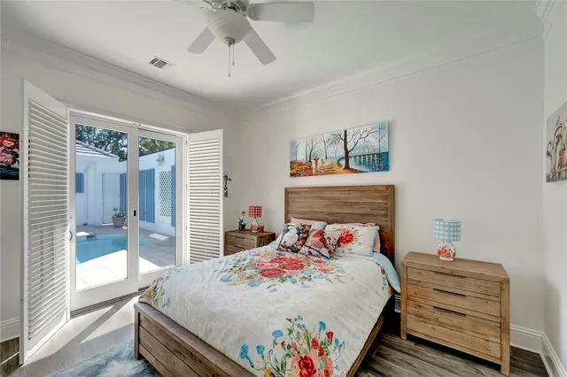 a living room with furniture chandelier and a fireplace