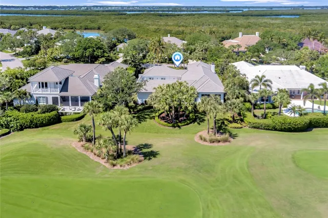 an aerial view of residential house with outdoor space and lake view