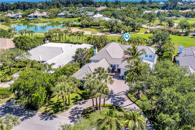an aerial view of residential house with outdoor space and lake view