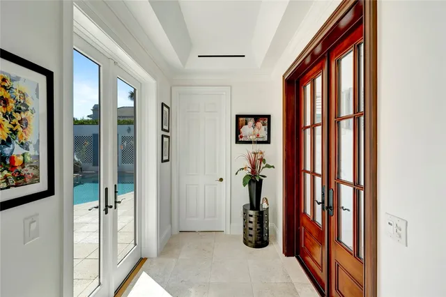 a view of a hallway with closet and a livingroom view