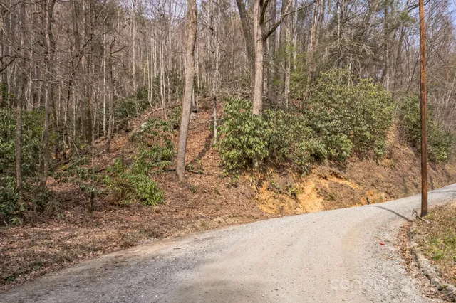 a view of a yard covered with snow in front of house