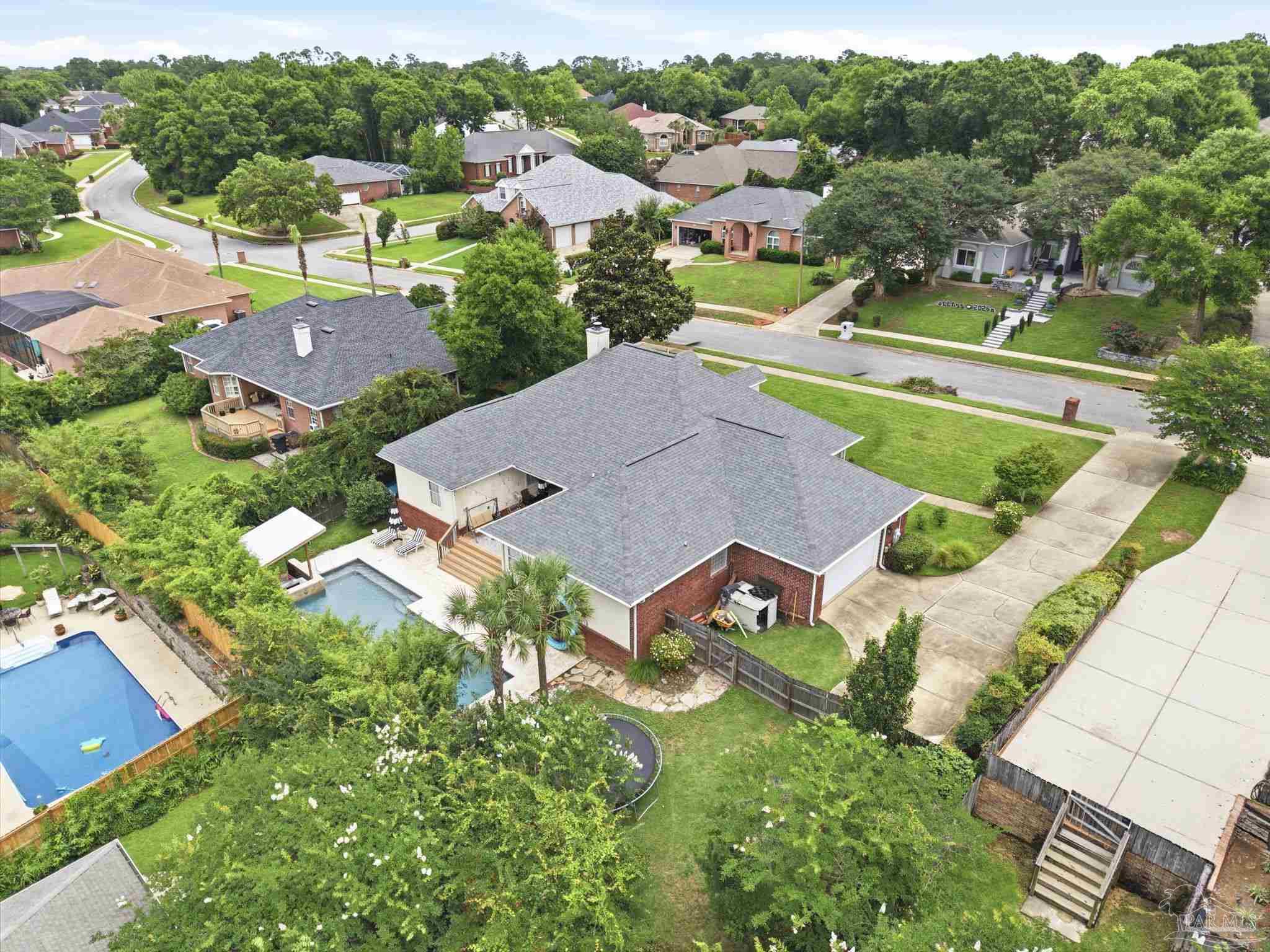 5931 Otter Point Road Pensacola, FL 32504 - Photo 52 of 67 an aerial view of a house with a garden