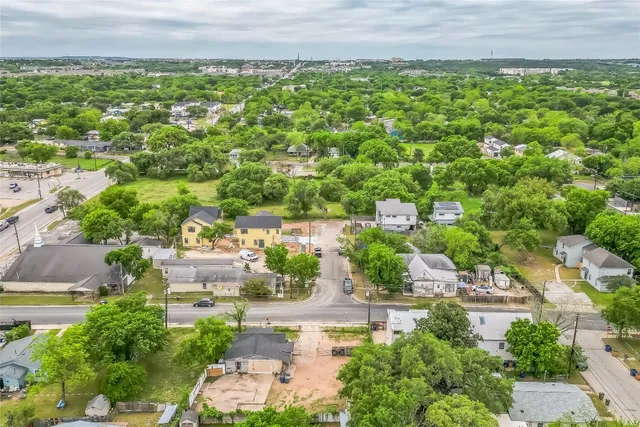 a view of a garden with a building in the background