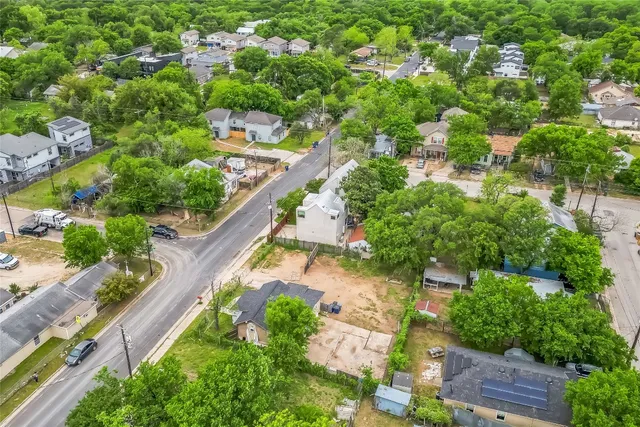 an aerial view of a house with a yard and a garden