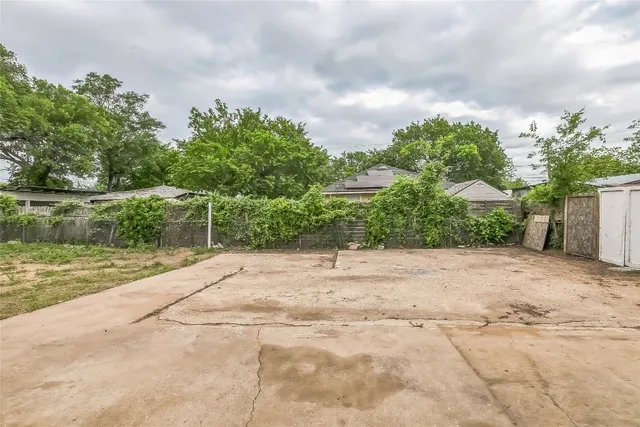 a backyard of a house with a yard and garage