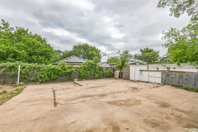 a view of a backyard with sitting area