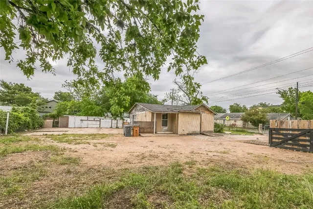 a house with trees in the background