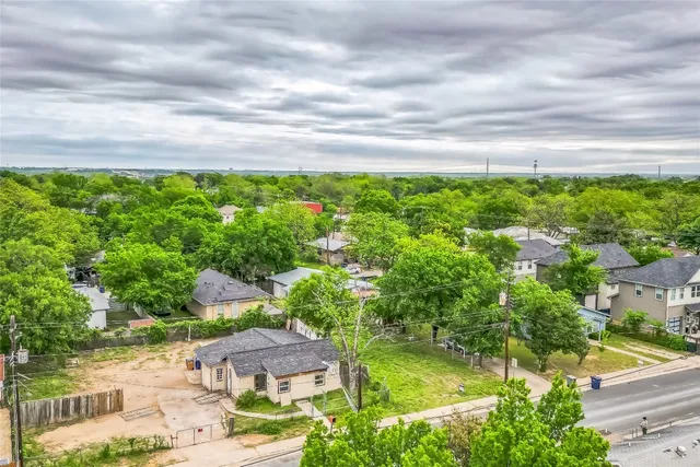 a view of a street with a building in the background