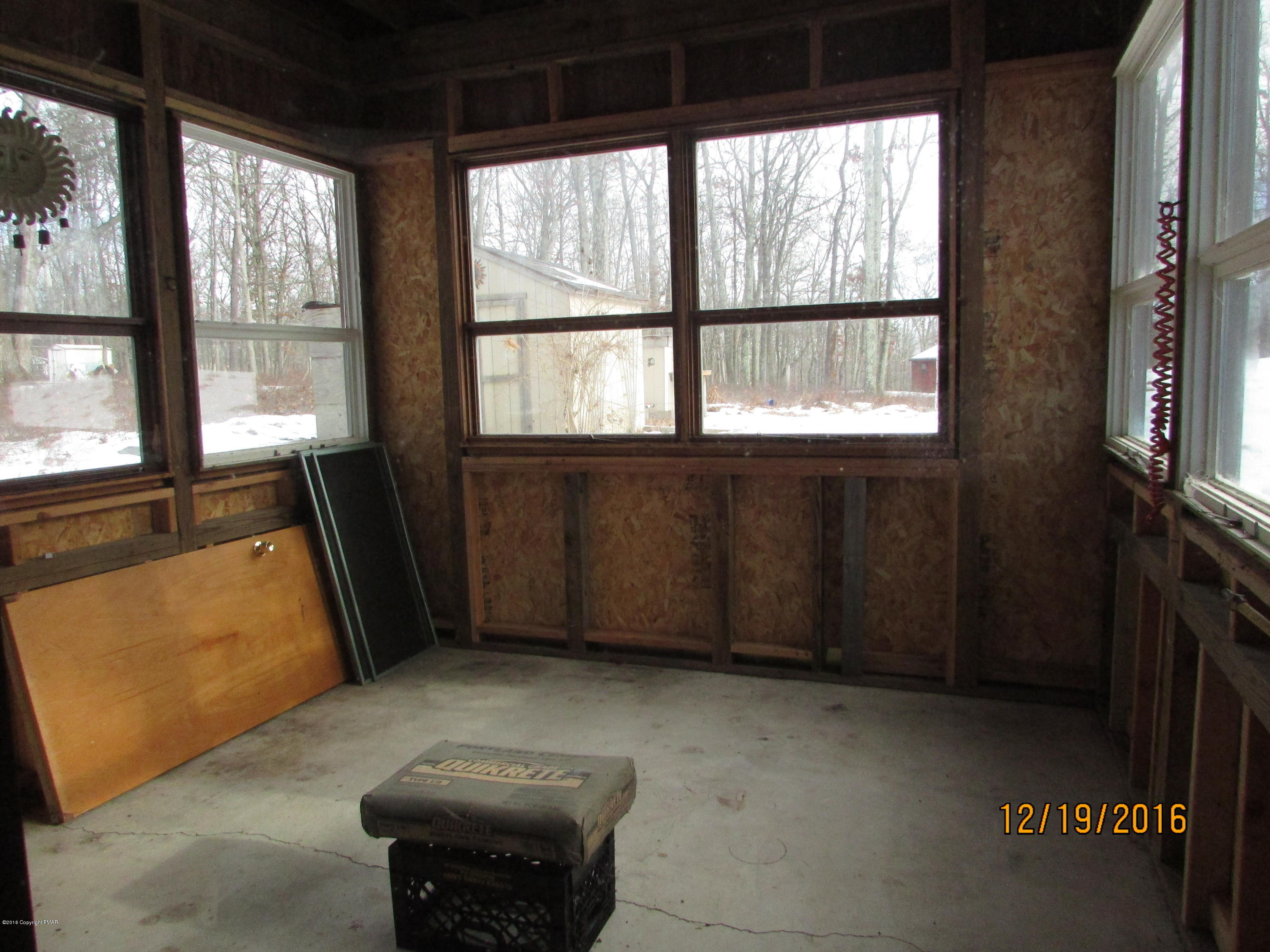 181 Doe Loop Bushkill, PA 18324 - Photo 21 of 34 181 Doe Loop lower level porch