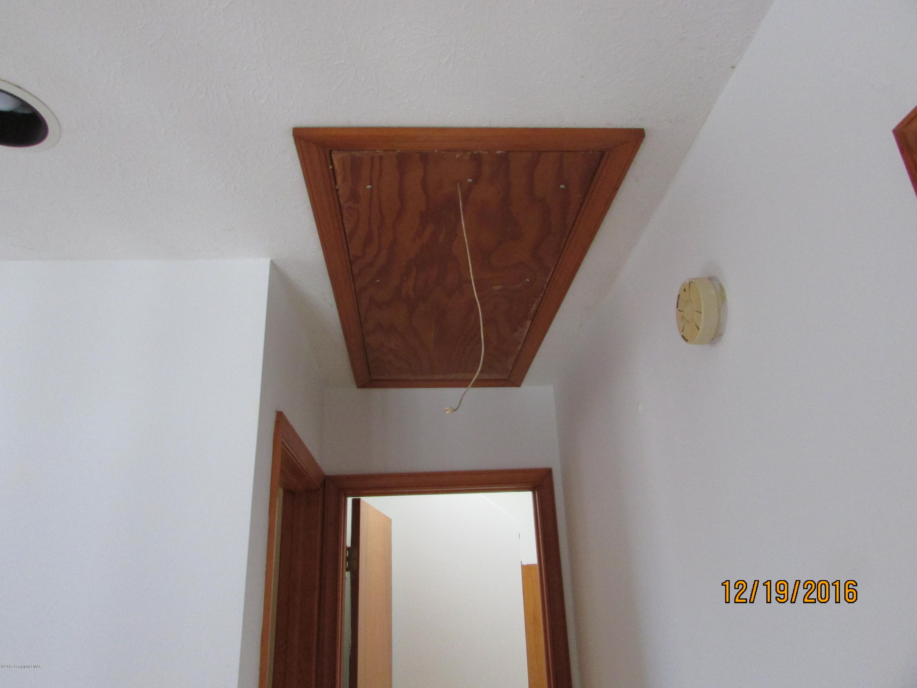 181 Doe Loop Bushkill, PA 18324 - Photo 26 of 34 181 Doe Loop Pull down attic stairs